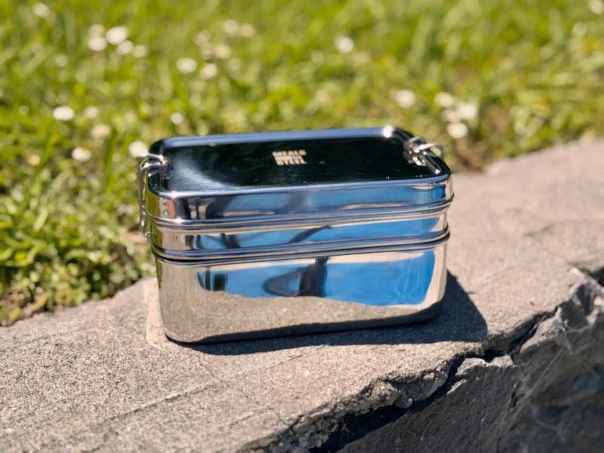 Double-layer rectangular stainless steel lunchbox showing two tiers and secure clips