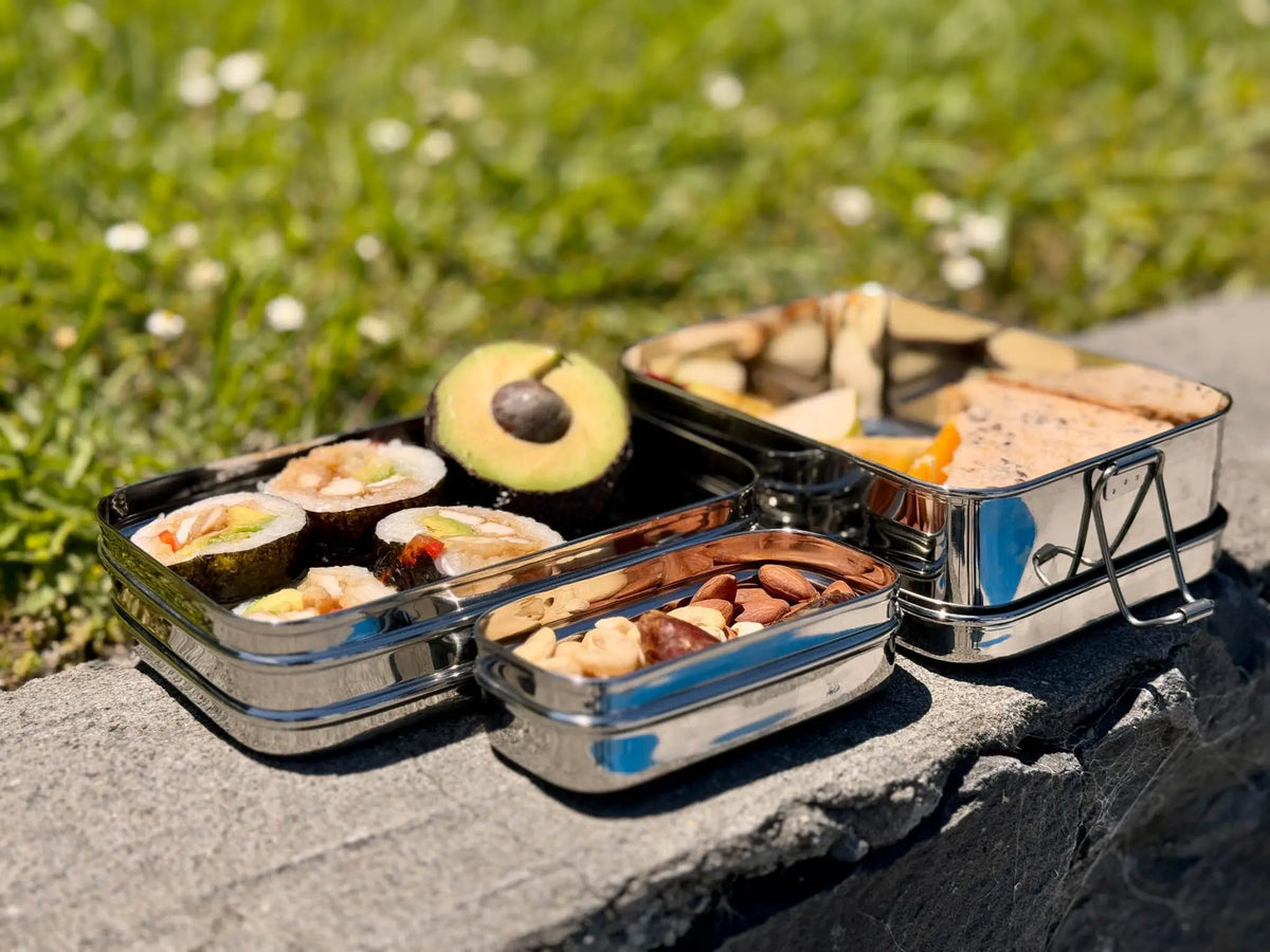 Open double-layer stainless steel bento lunchbox with removable snack box compartments