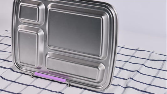 4-compartment stainless steel bento box with purple lid being opened and shown.